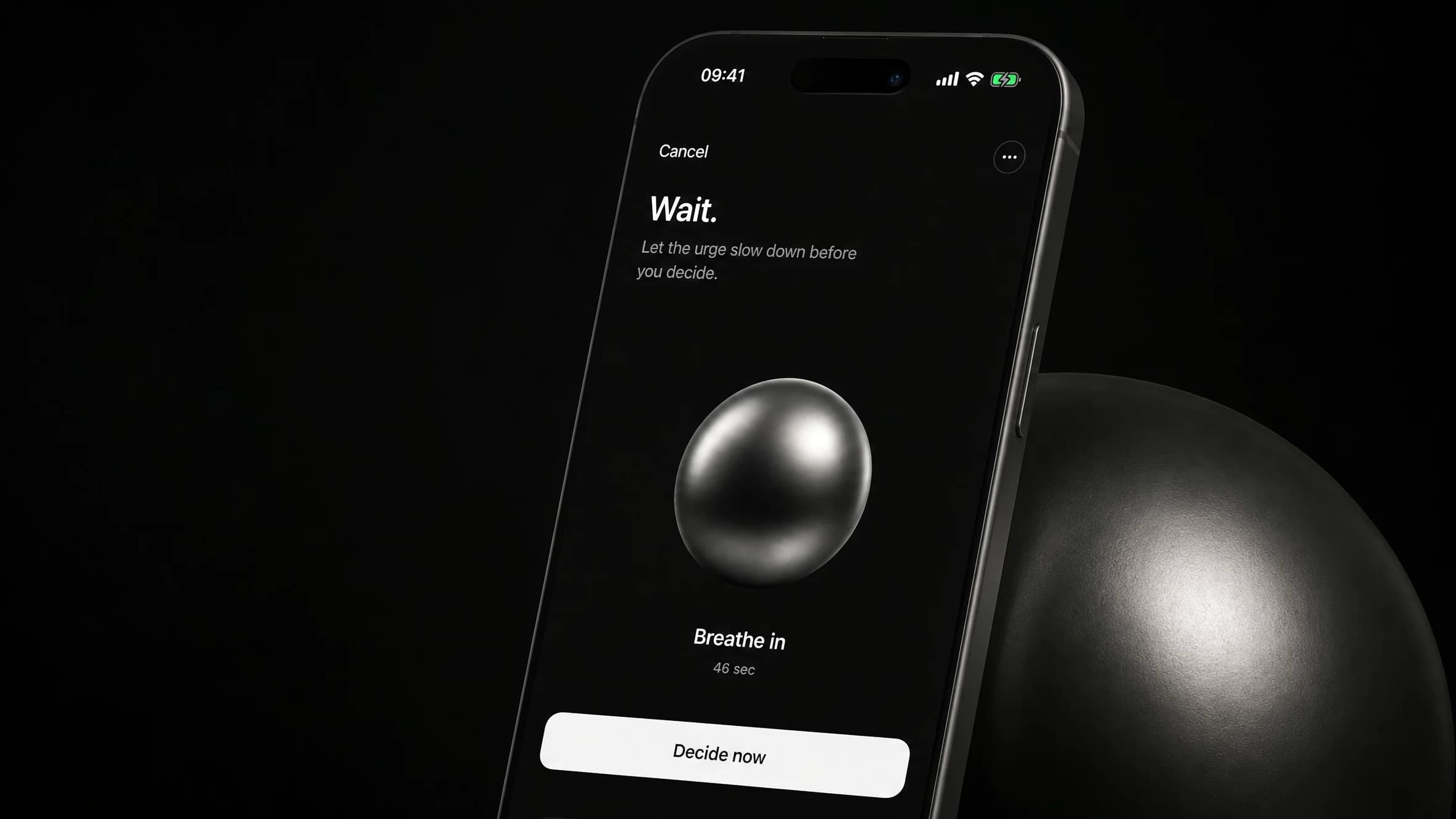 Close view of the Axyom breathing screen beside a large matte sphere lit from the left.
