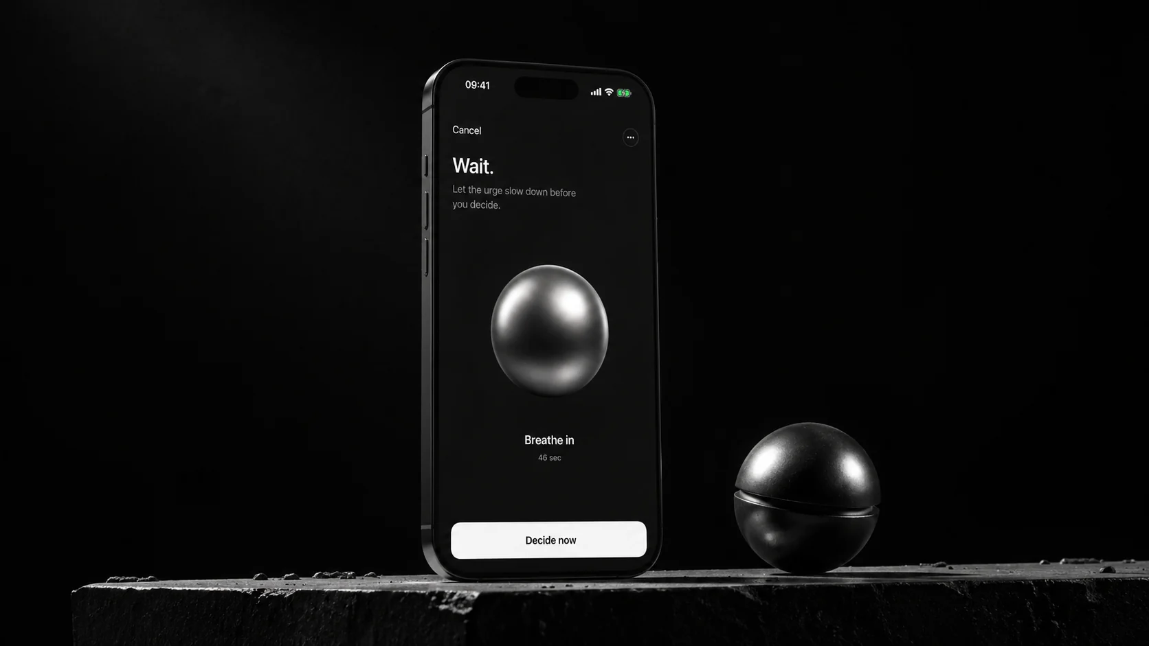 Axyom pause screen on a stone ledge, the metallic sphere beside it, reading Wait — let the urge slow down before you decide.